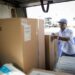 Mail carrier Edward Medley of Groveport, Ohio, loads his delivery truck with mail and packages for his Obetz route behind the South Columbus, Ohio branch of the United States Postal Service on March 10, 2021.
